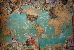 Money Lying on World Map