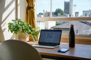 laptop on wooden table