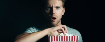 man eating popcorn