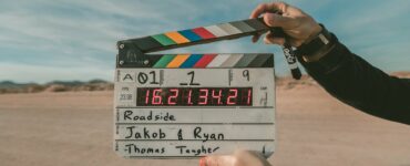 a person holding a clapperboard