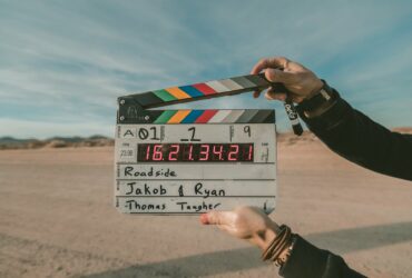 a person holding a clapperboard