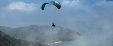 Skydiving Over A Foggy Coast