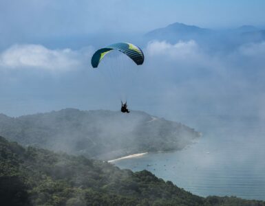 Skydiving Over A Foggy Coast